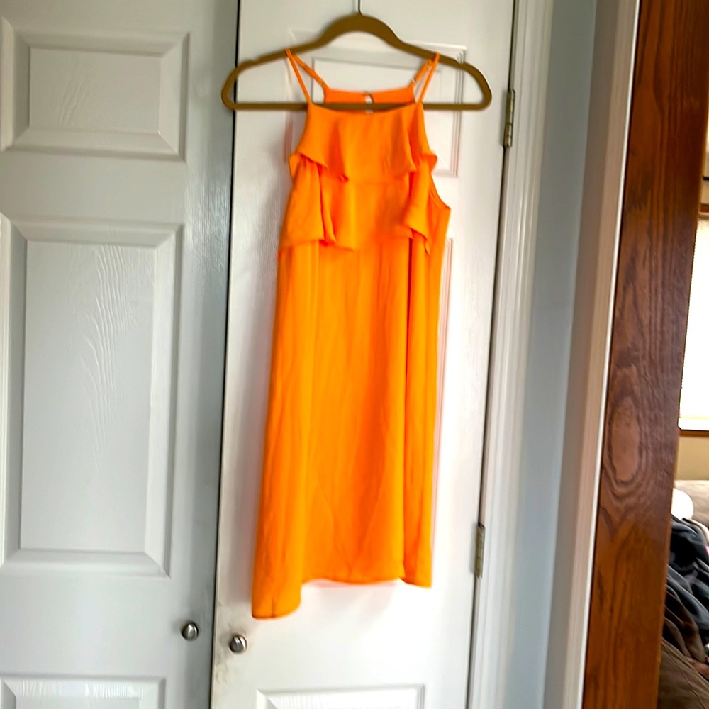 Skies are blue tangerine colored dress
